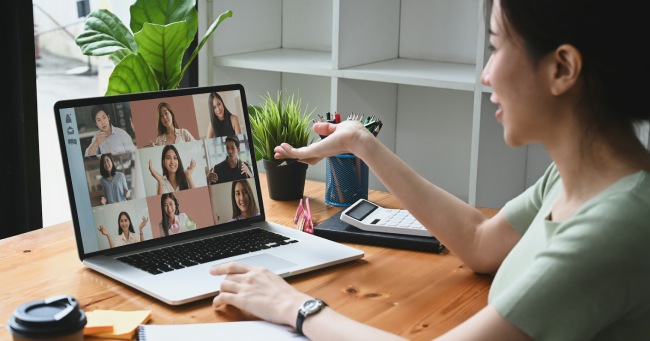 A woman speaking in an online conference