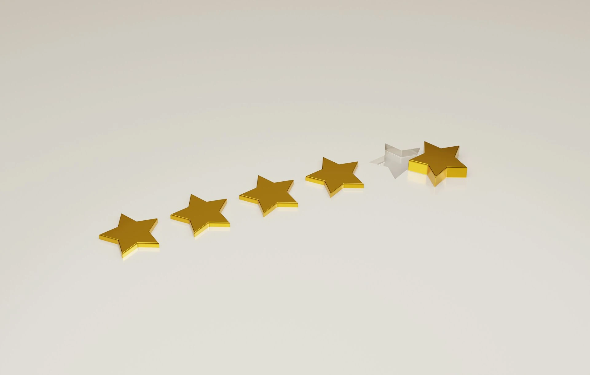 Row of five 3D stars on a reflective surface representing a 4-out-of-5 star rating.