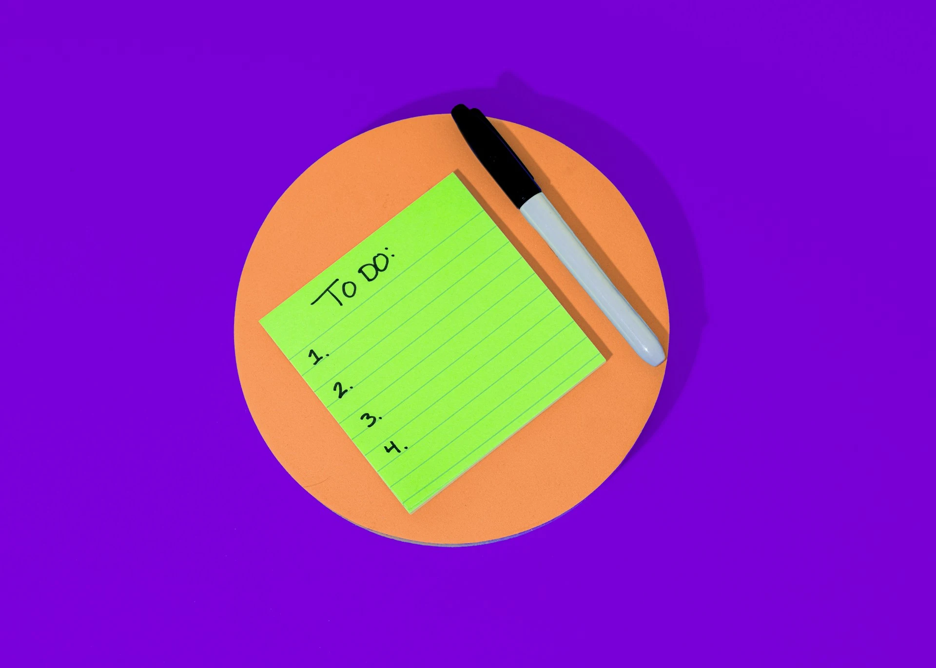  A green sticky note with a numbered "To Do" list.