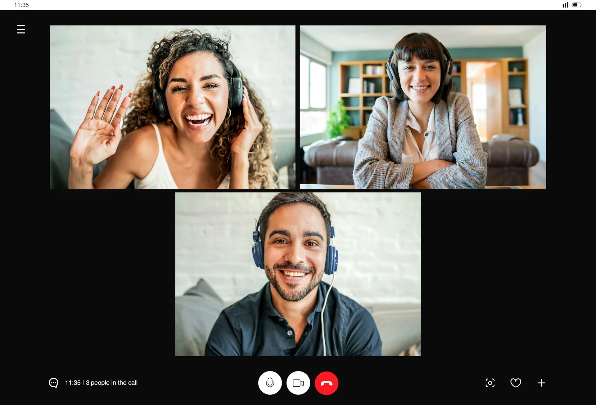 A video call interface featuring three smiling people.