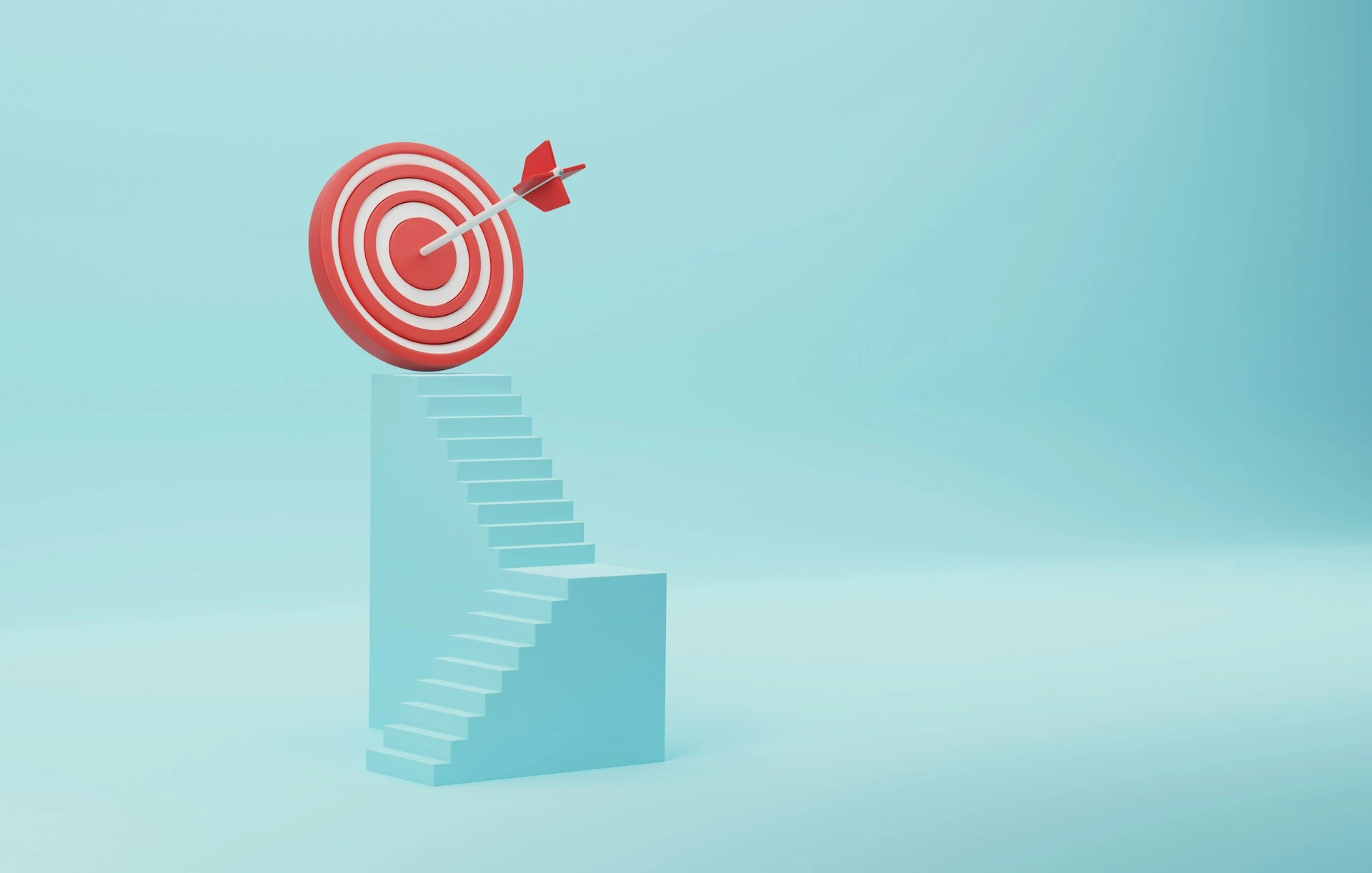 Arrow hitting the bullseye of a target placed on top of a staircase.