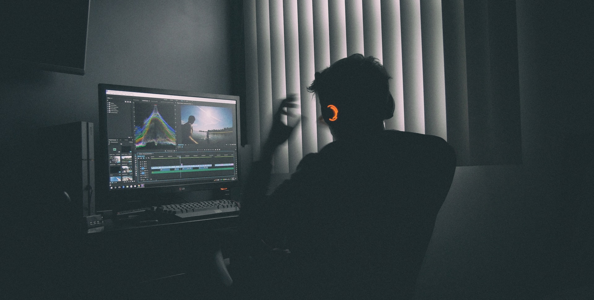 An editor working on a video on their computer
