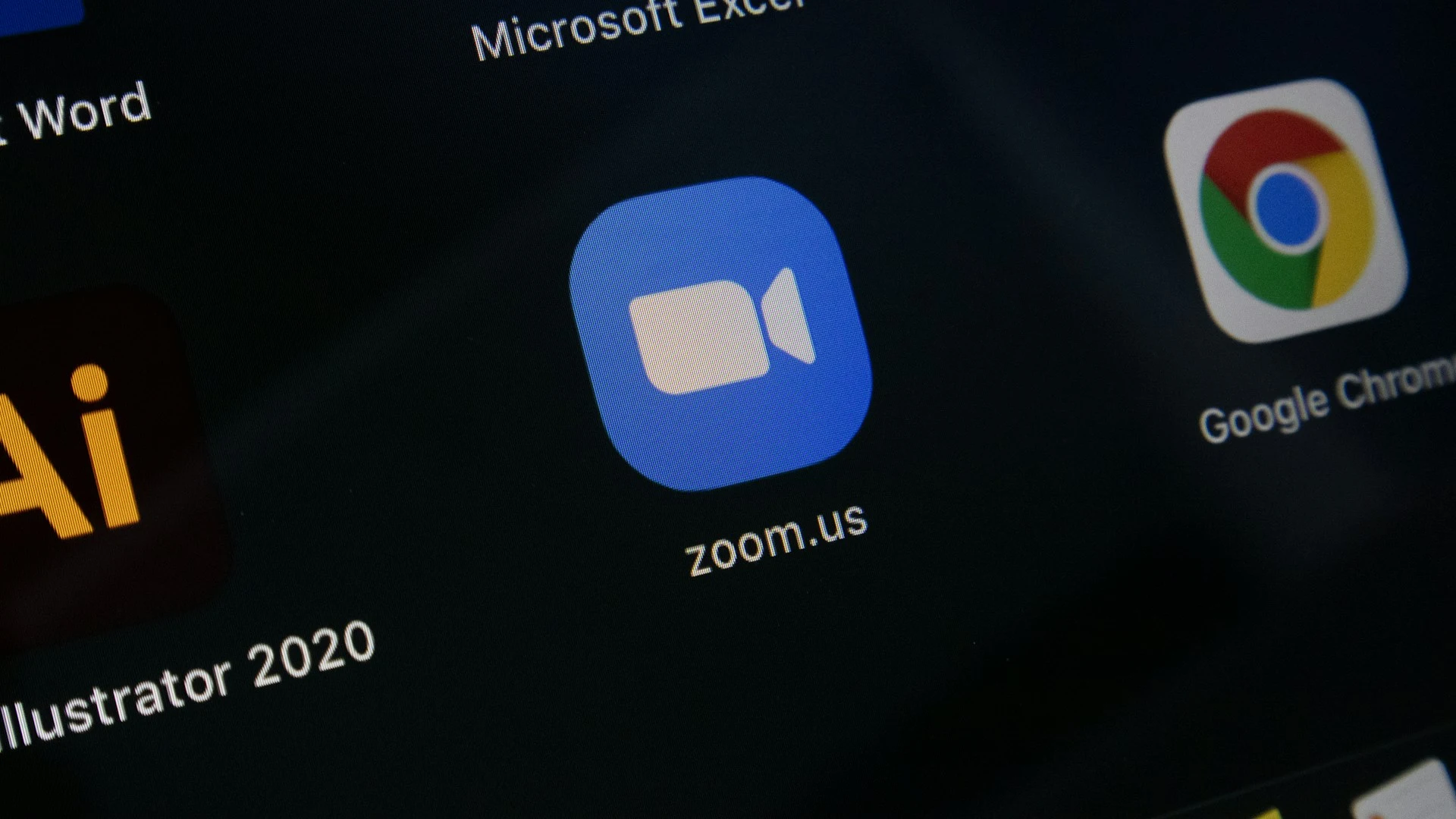  Close-up of the Zoom app icon on a digital screen.