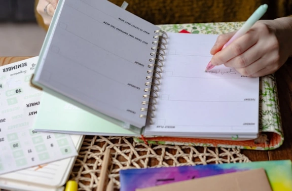 A student using a weekly planner.