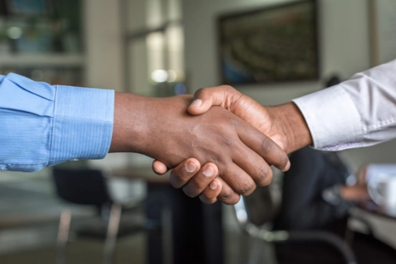 A close up of a hand shake.