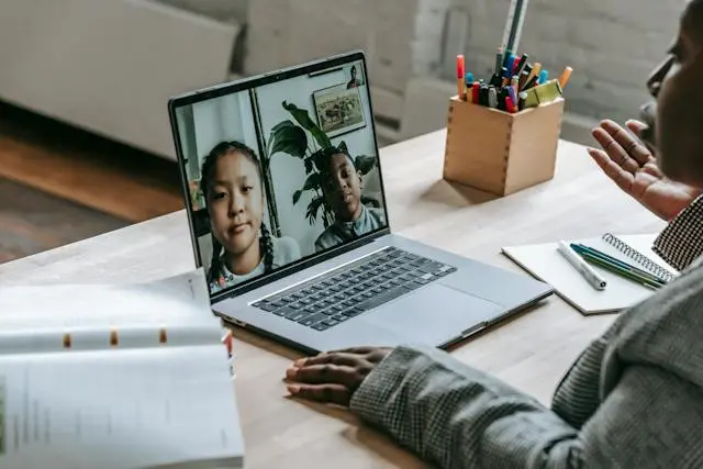 A teacher uses remote teaching tools while conducting a class.