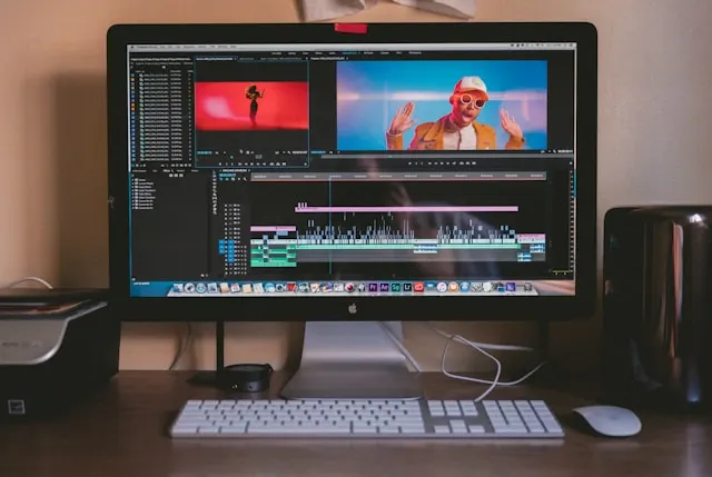 An iMac screen displaying a video editing software.