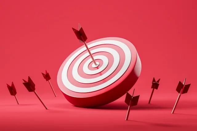 The illustration of an arrow hitting the center of a target, representing one-on-one meeting questions on career growth.