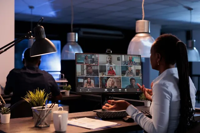 A woman having a virtual meeting with her colleagues.