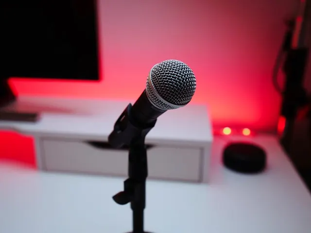 Close-up shot of a microphone on a white desk.