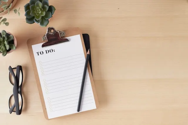 A clipboard with a to do list on it.