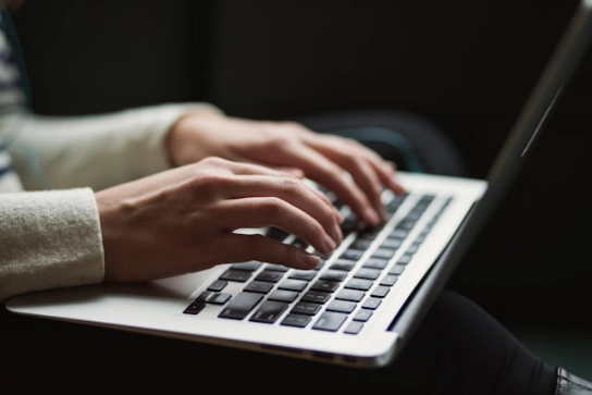 A person using a laptop.