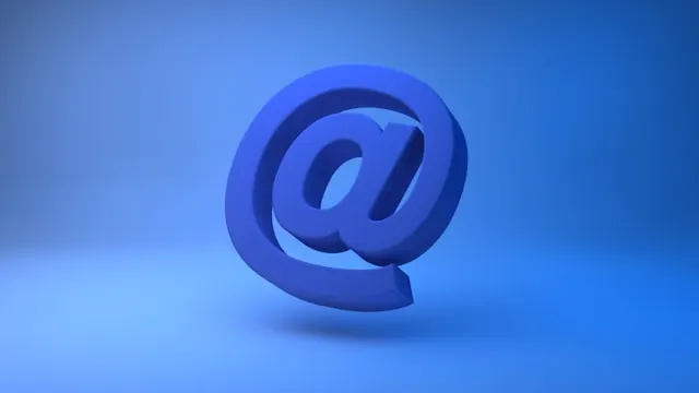 A blue email sign on a blue background, representing how to apologize for missing a meeting in an email.