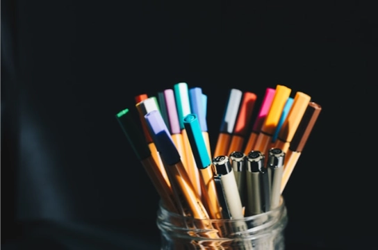 Colorful pens in a jar.