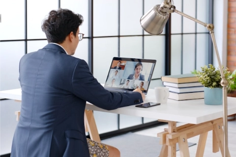 A business man having an online meeting.