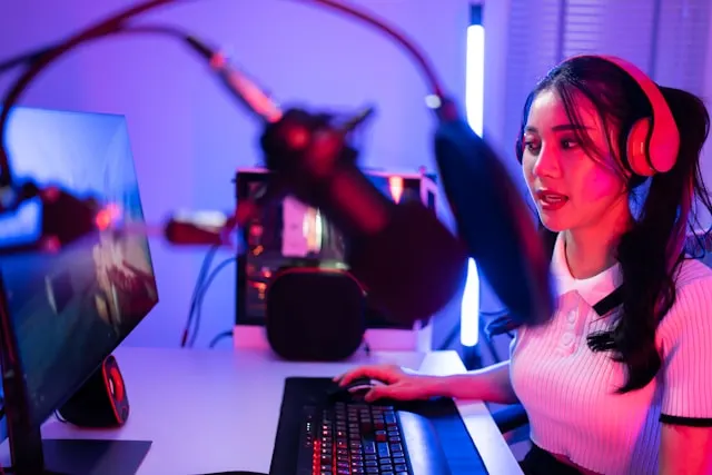 A woman gamer live streaming from her PC.