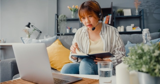 A woman wearing a headset.