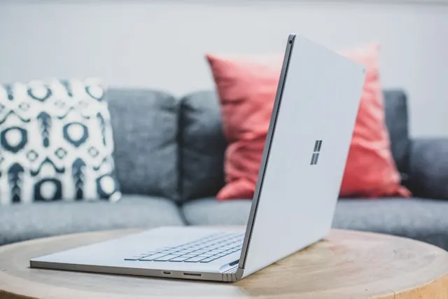 A Microsoft Surface laptop on a table.