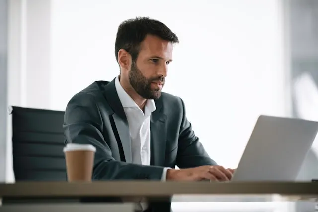 A businessman working on his laptop.